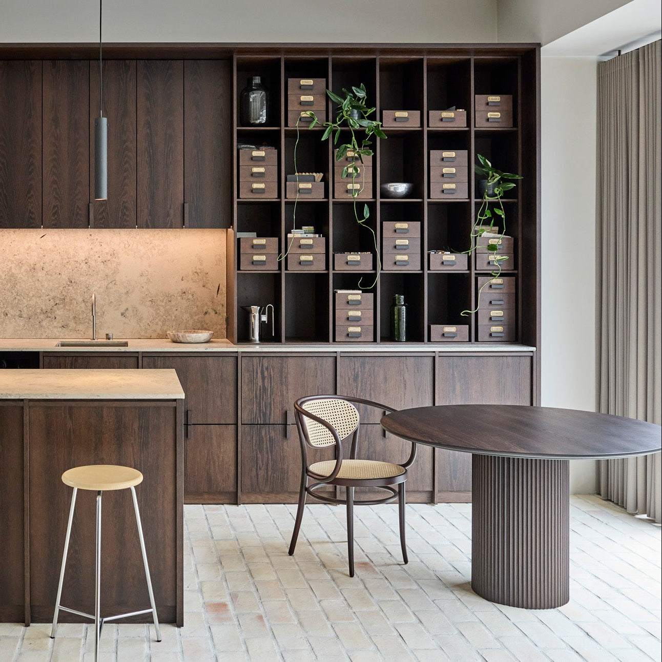 Modern kitchen with wooden cabinets, island, and bar stools.